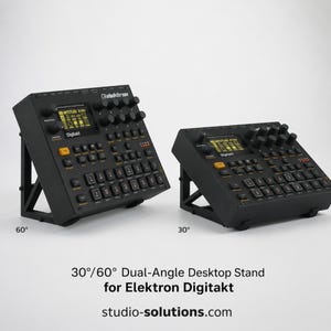May include: Two black Elektron Digitakt drum machines mounted on black stands. One stand is angled at 60 degrees and the other at 30 degrees. Text reads: 30/60 Dual-Angle Desktop Stand for Elektron Digitakt and studio-solutions.com.