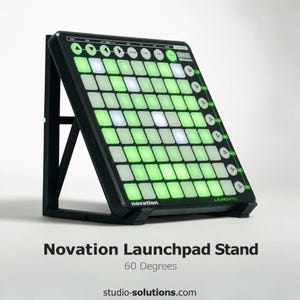May include: Black Novation Launchpad stand with a grid of green and white illuminated pads. The stand is angled at 60 degrees. The text "Novation Launchpad Stand" and "60 Degrees" are displayed.