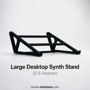 May include: Black desktop synth stand with a geometric design. The stand is angled at 22.5 degrees and features the text "Large Desktop Synth Stand".