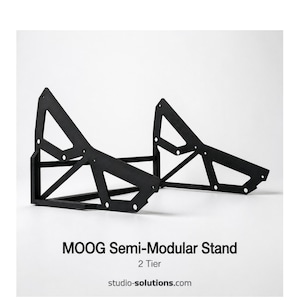 May include: Black, two-tier MOOG Semi-Modular Stand. The stand has a geometric design with triangular and rectangular shapes. The text "MOOG Semi-Modular Stand 2 Tier" is displayed below the stand. The website studio-solutions.com is also displayed.