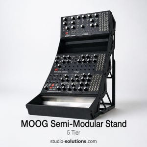 May include: A black MOOG semi-modular stand with a 5-tier design. The stand features multiple control panels with knobs and buttons. The text "MOOG Semi-Modular Stand" and "5 Tier" are visible. The website address "studio-solutions.com" is also displayed.