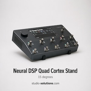May include: A black Neural DSP Quad Cortex stand with multiple silver knobs and a screen. The stand is angled at 15 degrees and features the text "1C Quad Cortex". The website studio-solutions.com is also visible.
