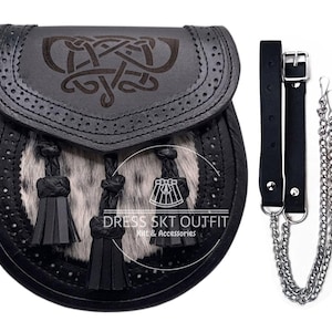May include: A black leather sporran featuring a Celtic knot design on the flap, a grey and black fur front panel, and three black leather tassels. The sporran includes a black leather belt strap with a silver buckle and a silver metal chain.