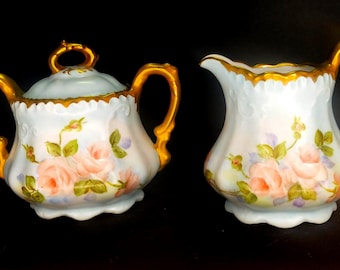 Juego de azucarero y jarra para crema de porcelana pintada a mano de RS Germany con rosas.