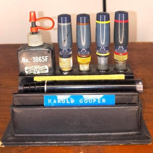 May include: A set of three ceramic mugs with a speckled, matte finish. The mugs are in shades of cream, light gray, and dark gray. Each mug has a simple, minimalist design, perfect for coffee or tea.