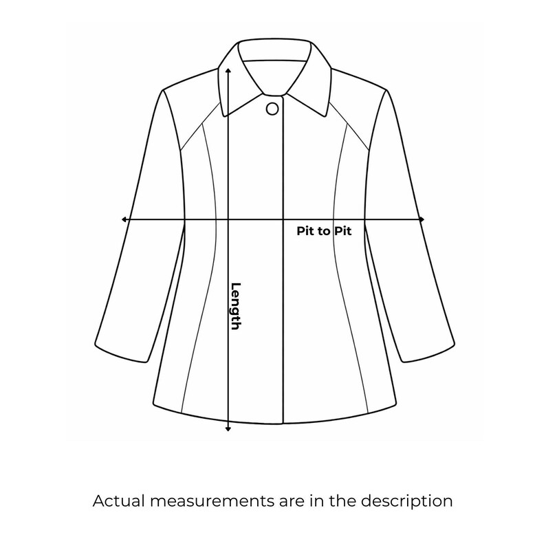 May include: Line drawing of a jacket with measurements labeled "Pit to Pit" and "Length." The text "Actual measurements are in the description" is below the jacket.