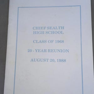 May include: A white booklet with a light blue border and text. The text reads "CHIEF SEALTH HIGH SCHOOL CLASS OF 1968 20-YEAR REUNION AUGUST 20, 1988". The cover is slightly textured.