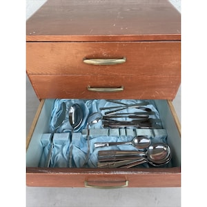 May include: A set of three ceramic mugs with a speckled, matte finish. The mugs are in shades of cream, light gray, and dark gray. Each mug has a simple, minimalist design, perfect for coffee or tea.