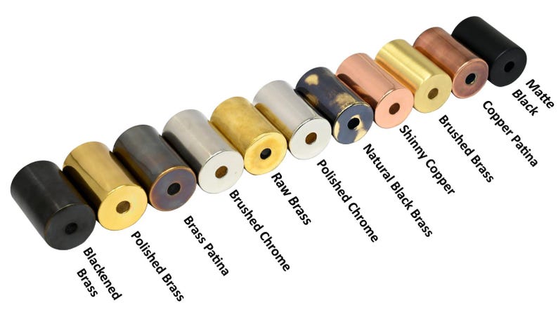 May include: A collection of cylindrical metal objects in various finishes, including matte black, copper patina, and brushed brass. The image displays a range of colors and textures, with labels identifying each finish. These are likely decorative hardware or components.