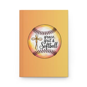 May include: A notebook with a softball design. The cover is a gradient of yellow and orange. A softball graphic with the words "grace, grit & Softball" and a cross is in the center.