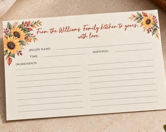 May include: A rectangular recipe card with a cream background, featuring sunflower and autumn leaf illustrations in the corners. The text reads, From the Williams Family kitchen to yours, with love. It includes lines for recipe name, time, servings, and ingredients.