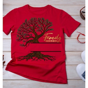 May include: A red short-sleeved t-shirt featuring a graphic of a brown tree with green leaves. The text "Family REUNION" is printed in gold script above two horizontal black lines that provide a space for custom text to be added.