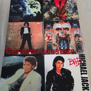 May include: Set of six ceramic coasters featuring album art of Michael Jackson. The coasters showcase album covers like "Thriller," "Bad," and "Off the Wall." Each coaster is square and has a glossy finish.
