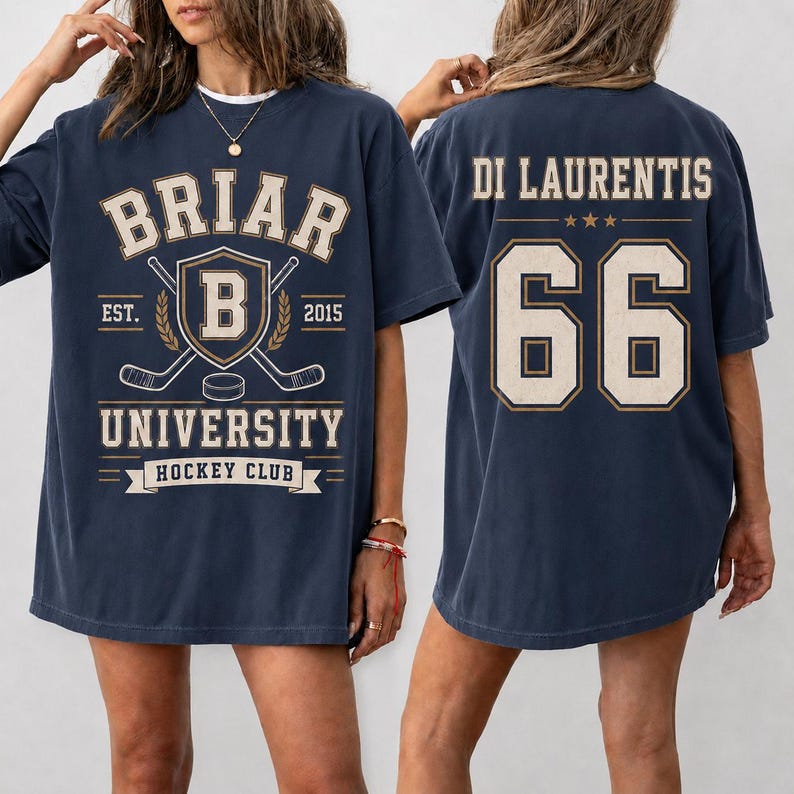 A woman wearing a navy blue t-shirt with the text "BRIAR UNIVERSITY HOCKEY CLUB" printed on it.