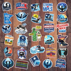 May include: A collection of colorful stickers with various designs and text. The stickers feature images of loons, the state of Minnesota, and phrases like "Minnesota Strong" and "Ice Out of Minnesota."