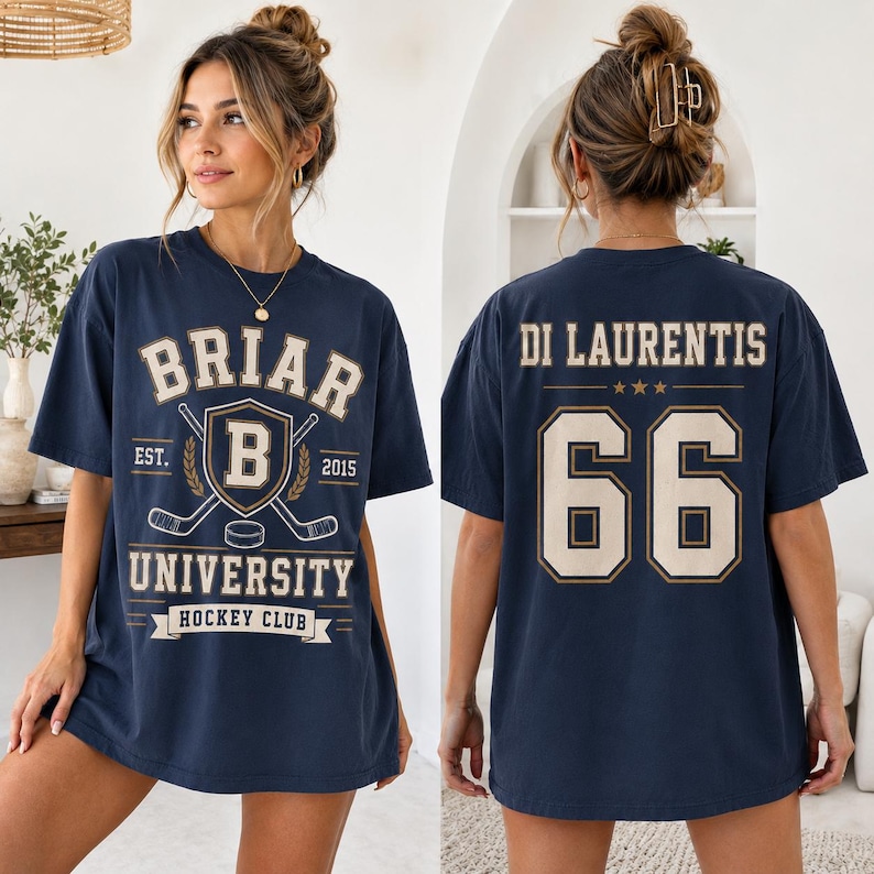 A woman wearing a navy blue t-shirt with the text "BRIAR UNIVERSITY HOCKEY CLUB" printed on it.