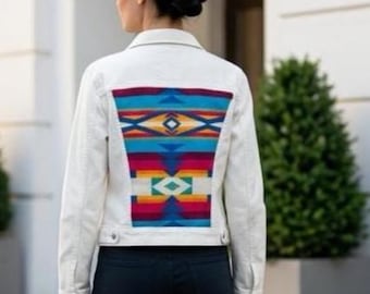 White denim jacket with a vibrant Pendleton jacquard fabric on the back and shoulders. Eco‑friendly, bold, and one of a kind.