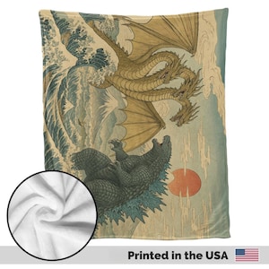 May include: A soft blanket with a Japanese-style illustration of a three-headed dragon and a sea monster fighting near a large wave. The blanket is printed in the USA.