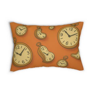 May include: An orange rectangular pillow featuring a repeating pattern of gold pocket watches. The watches have black hands and Roman numerals. The pillow is a decorative item.