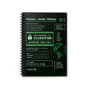 May include: A black spiral-bound notebook featuring a green digital interface design. The cover displays text including PERSONAL SECURE TERMINAL, THIS MATERIAL IS CLASSIFIED, and a globe graphic, mimicking a computer terminal screen with system logs.