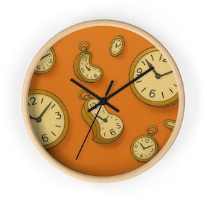 May include: A round wall clock with a light wood frame and an orange face. The face features multiple pocket watch designs in shades of yellow and black. The clock hands are black.