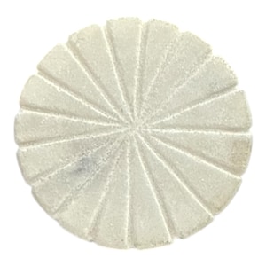 May include: A round, off-white decorative object with a radial design. The object is made of a textured material and features triangular segments radiating from a central point. The overall shape resembles a stylized sun or flower.