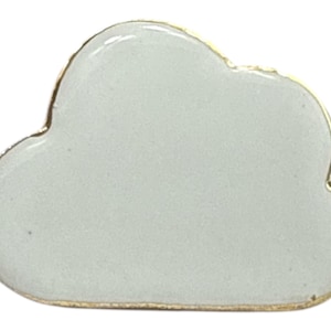 May include: A cloud-shaped pin with a gold-colored border. The pin has a light gray enamel fill. The pin is a small accessory, suitable for jackets, bags, or other fabric items. The cloud shape is a simple, modern design.