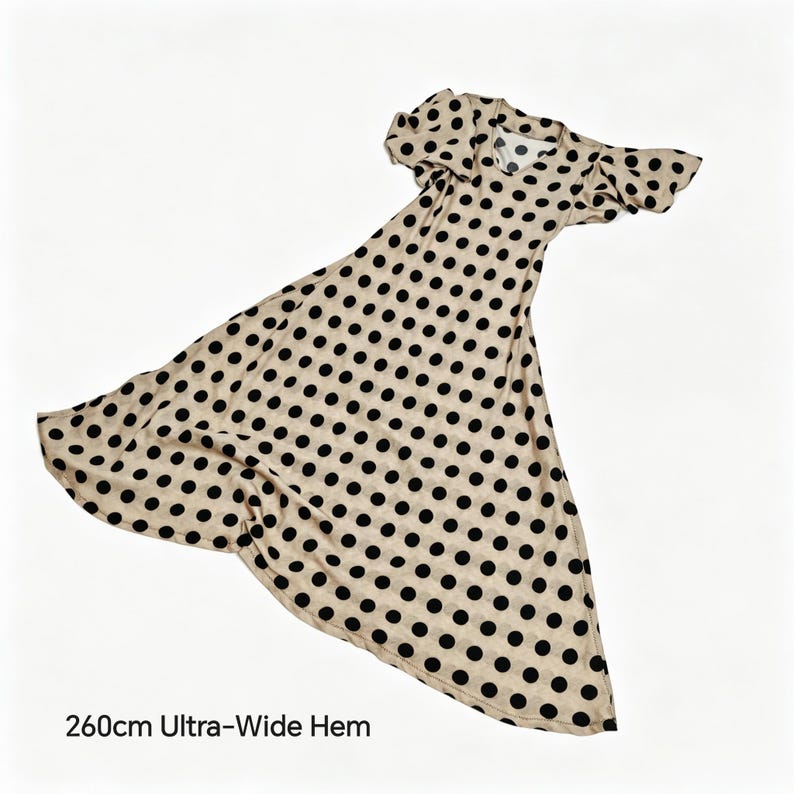 May include: A beige dress featuring a black polka dot pattern, short flutter sleeves, a round neckline, and a 260cm ultra-wide hem. The garment displays a flared silhouette that extends outward, showcasing the full circular cut of the skirt.