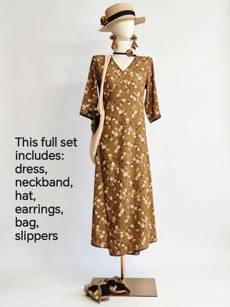 May include: A complete outfit on a mannequin, including a brown floral print dress, hat, earrings, bag, and slippers. The dress has a V-neck and three-quarter sleeves. The text on the left says "This full set includes: dress, neckband, hat, earrings, bag, slippers."