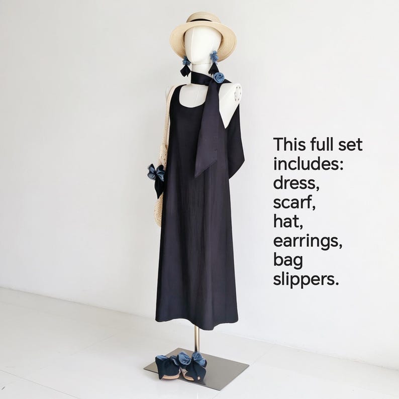 May include: A complete fashion set on a mannequin, including a black dress, scarf, hat, earrings, bag, and slippers. The hat is beige, and the earrings and slippers have blue accents. The text on the right says "This full set includes: dress, scarf, hat, earrings, bag slippers."