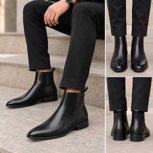 May include: A pair of black ankle boots featuring a textured snakeskin-like pattern, a pointed toe, and a low block heel. The boots have a sleek silhouette with a pull tab at the back and are worn with black trousers, showing front and back views.