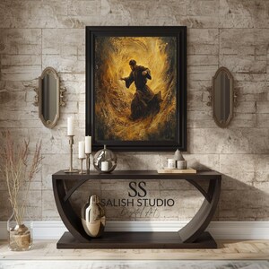 May include: A framed artwork depicts a figure in dark robes amidst swirling golden light. The artwork hangs above a dark brown console table with a curved design. Two decorative mirrors and candles flank the artwork, with a vase and a metallic decorative object on the table.