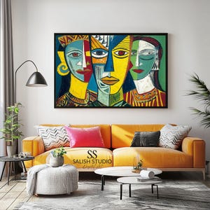 May include: Abstract art print featuring three stylized faces with bold colors. The artwork, framed in black, showcases a vibrant palette of yellow, blue, red, and green. The print hangs above a yellow sofa with decorative pillows, creating a modern living room aesthetic.