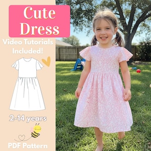 Pode incluir: Uma menina usando um vestido floral rosa com mangas esvoaçantes. A imagem inclui o texto "Cute Dress", "Video Tutorials Included!", "2-14 years" e "PDF Pattern". Um desenho do vestido também é mostrado.