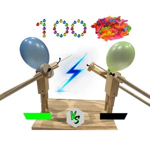 May include: A wooden balloon launcher with a blue and green balloon, a blue lightning bolt graphic, and the word "VS". The image also shows the number "100" made of colorful beads and a pile of colorful balloons.