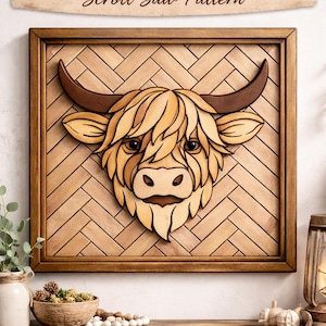 May include: Wooden framed artwork featuring a Highland cow design. The cow's head is intricately layered with light and dark wood tones, with dark brown horns. The background has a herringbone pattern. The text "HIGHLAND COW Scroll Saw Pattern" is at the top.