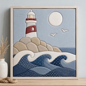 May include: A square fabric wall art piece featuring a layered textile lighthouse in white and red, set against a light blue background. The scene includes a white moon, two white birds, beige rocky cliffs, and stylized dark blue ocean waves.