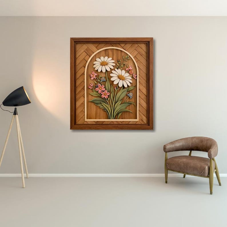 May include: Wooden wall art featuring a carved floral design. The artwork showcases a bouquet of daisies, pink flowers, and green leaves within an arched frame. The frame is a dark brown color, and the background has a woven pattern.