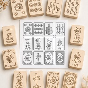 May include: A collection of wooden Mahjong tiles and a printed sheet with matching designs. The tiles feature engraved symbols, numbers, and illustrations, including flowers, bamboo, and circles. The game pieces are arranged on a light background.