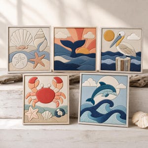 May include: A set of five square wall art panels featuring coastal themes. The designs include a seashell collection, a whale tail at sunset, a pelican on a post, a red crab on the sand, and a dolphin jumping over blue ocean waves.