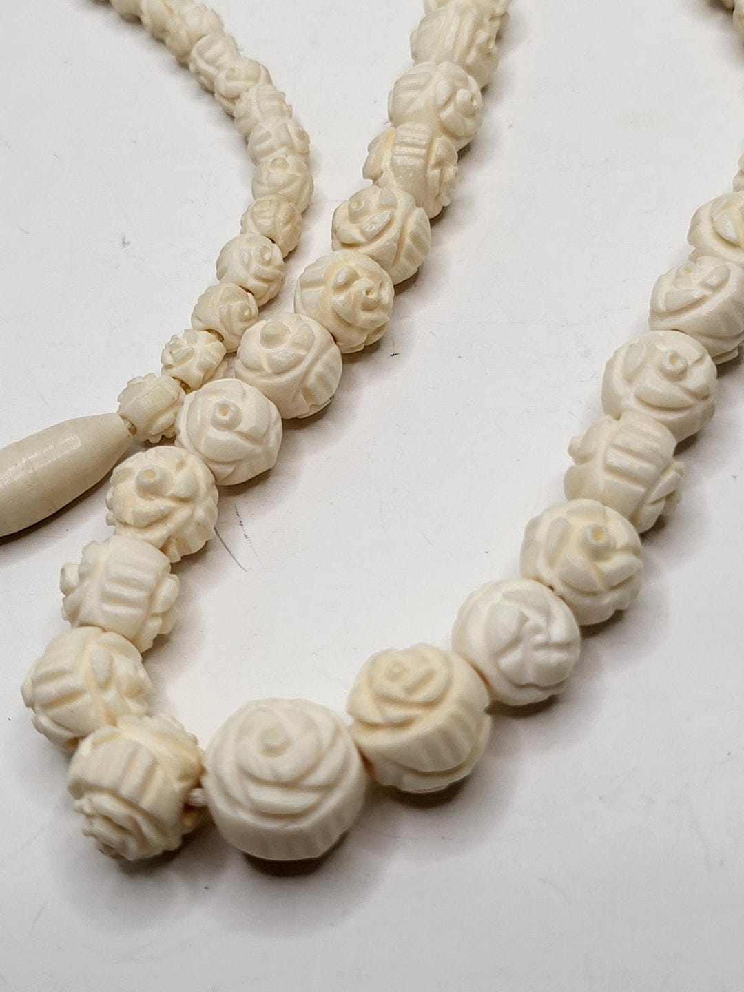 Vintage 1970s Hand carved Bone Bead Necklace 26 Graduated Beads Floral vintage-1970s-hand-carved-bone-bead-necklace-26-graduated-beads-floral