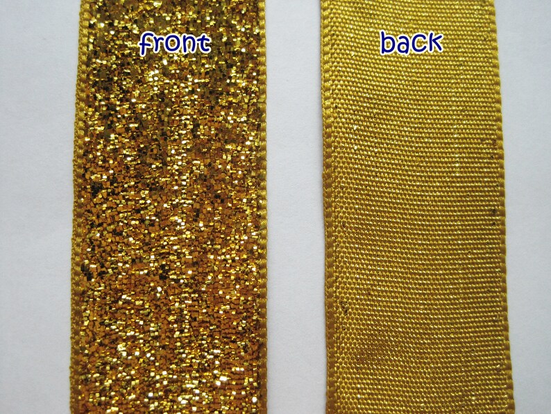 May include: Gold ribbon with a glittery front and a plain back. The ribbon is labeled "front" and "back".