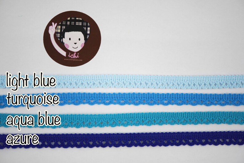 May include: Four different shades of blue lace trim, from light blue to azure. The lace trim is delicate and has a scalloped edge.