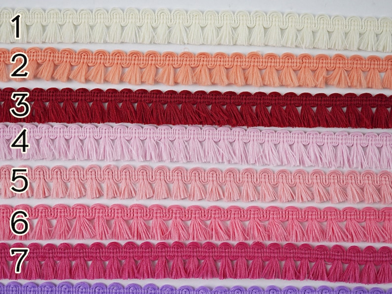 May include: Seven rows of white, peach, red, pink, light pink, hot pink, and purple fringe trim. Each row is labelled with a number from 1 to 7.
