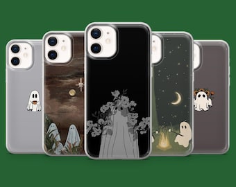 May include: A collection of five phone cases with unique designs. The cases feature various illustrations, including a ghost with a coffee cup, a landscape with ghosts, a ghost with flowers, a campfire scene, and a ghost with a floral crown. The cases are in a row.