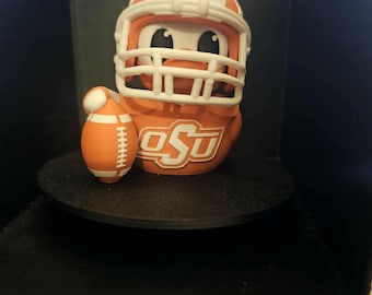 Mascota de los Oklahoma State Cowboys: Pato. Producto oficial impreso en 3D. Regalo ideal para aficionados.