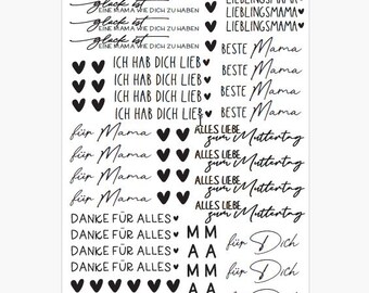 May include: A white sheet with various black text phrases and heart illustrations. Phrases include "Glück ist eine Mama wie dich zu haben" and "Ich hab dich lieb". Other phrases include "Lieblingsmama" and "Beste Mama".