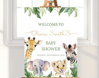 May include: A baby shower sign on a wooden easel. The sign features a watercolor design with a giraffe, zebra, elephant, and lion. The text reads "Welcome to Olivia Smith's Baby Shower" and the date.