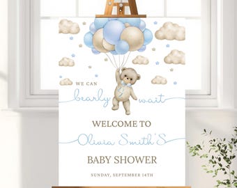 Pode incluir: Uma placa de chá de bebê em um cavalete. A placa apresenta um ursinho de pelúcia segurando balões azuis, nuvens e estrelas. O texto diz "We can bearly wait" e "Welcome to Olivia Smith's Baby Shower, Sunday, September 14th."