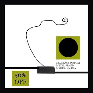 May include: A minimalist black metal necklace display stand with a curved design. The stand is accompanied by a green square with a black circle and the text "NECKLACE DISPLAY METAL STAND MADE in the USA". A green square with "50% OFF" is also present.